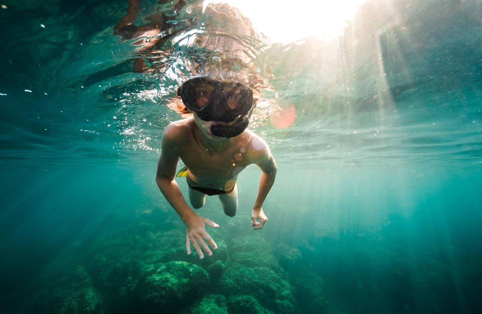 young boy snorkeling